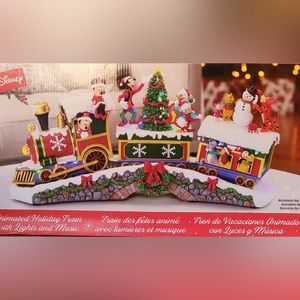 Disney Holiday Train with lights and music.   Brand new